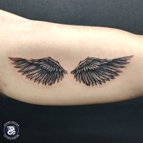 angel with wing tattoo|realistic angel wings tattoo.